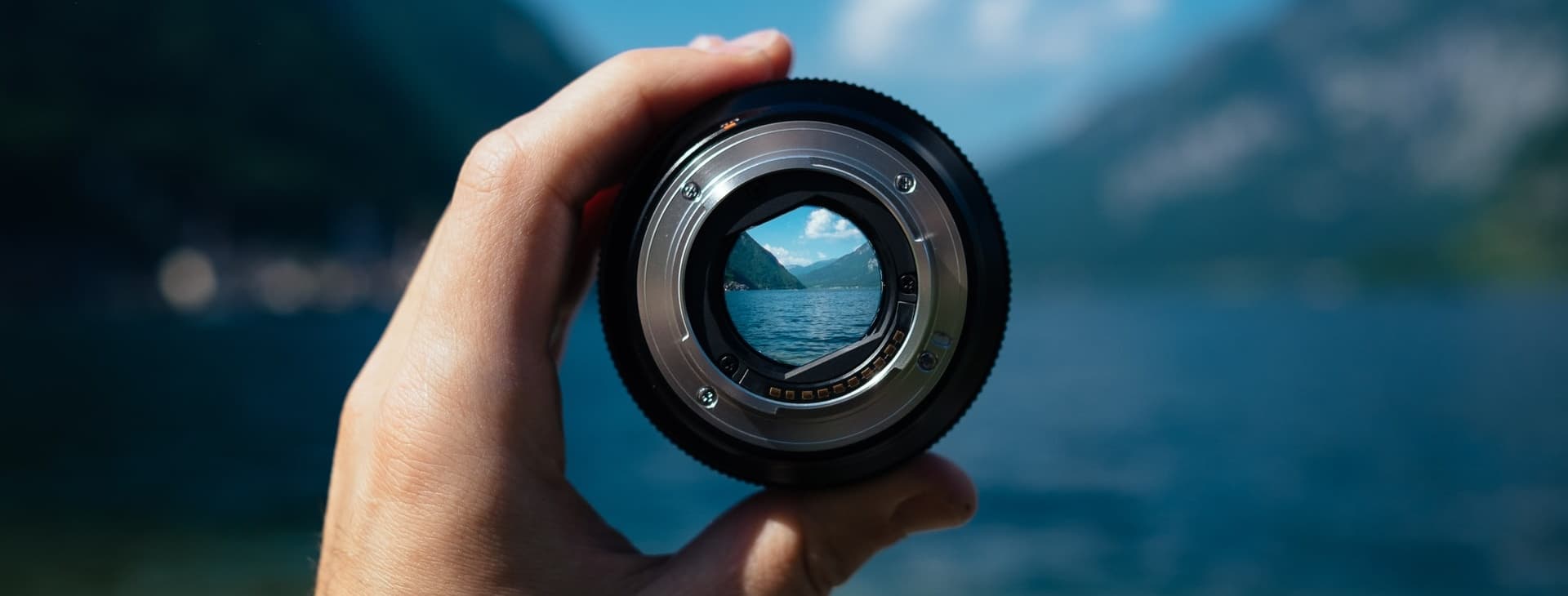 Mountain lake in camera lens. Photo by Paul Skorupskas on Unsplash